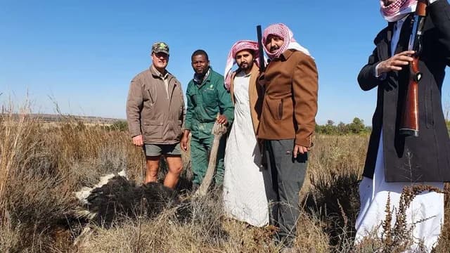 Distinguished International Hunting Delegation in Traditional Thobe