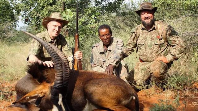 Successful Outfitter Handshake over Giant African Ostrich